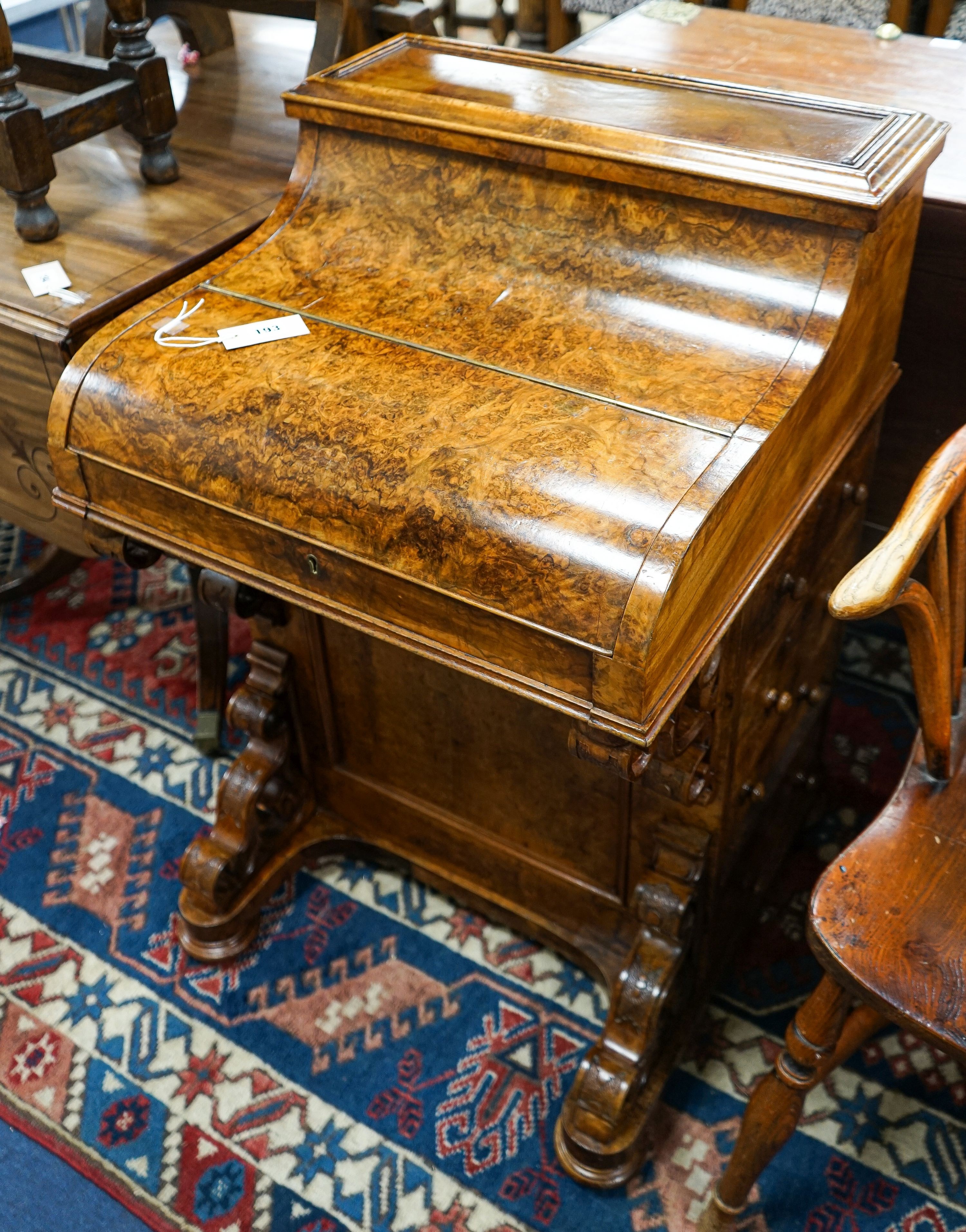 An Irish burr walnut piano top Davenport marked J J Byrne, 6 Henry Street, Dublin, width 56cm, depth 55cm, height 89cm